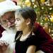 Santa talks to Ann Arbor resident Natalie Serban, seven, while she sits on his lap after the Sing Along With Santa Event on Saturday. Daniel Brenner I AnnArbor.com